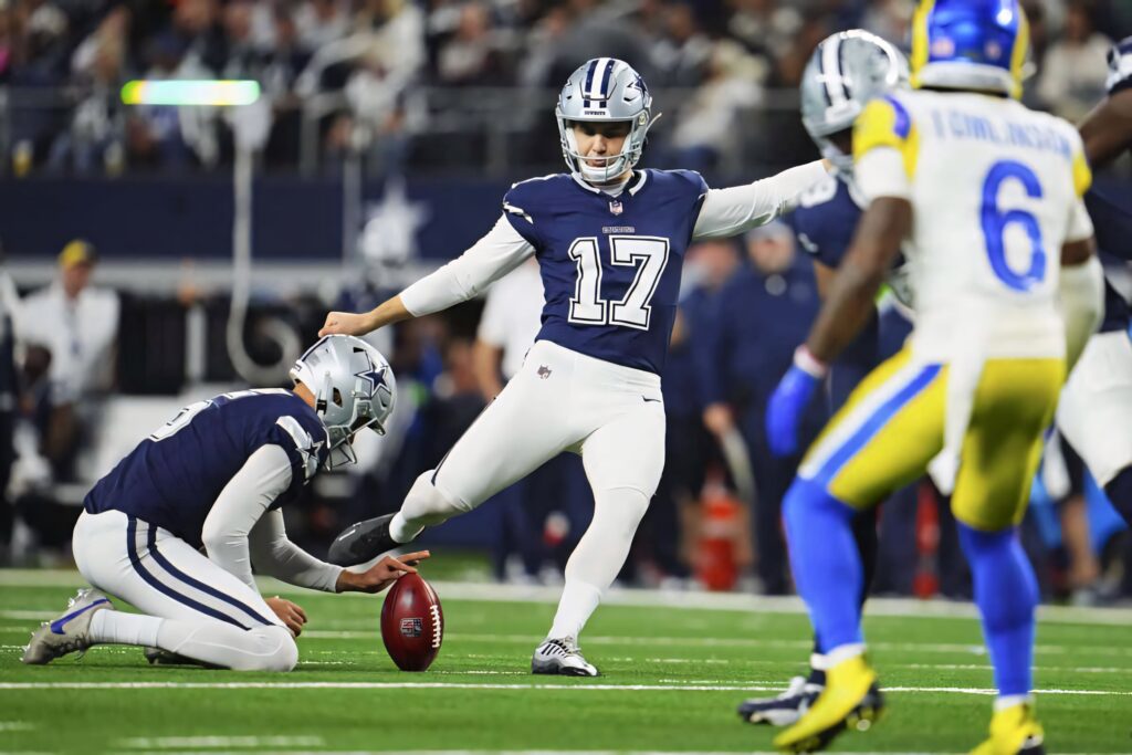 Brandon Aubrey Dallas Cowboys kicker in action NFL game navy white uniform stadium lighting Wallpaper