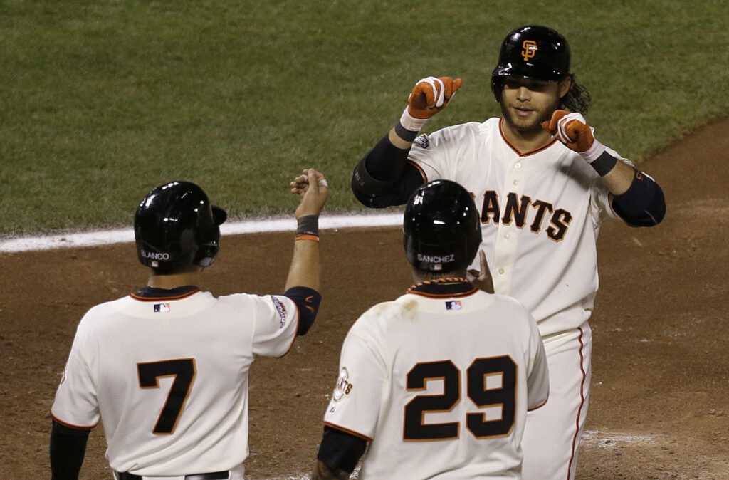 Brandon Crawford celebrates with San Francisco Giants teammates in dynamic MLB game scene wallpaper