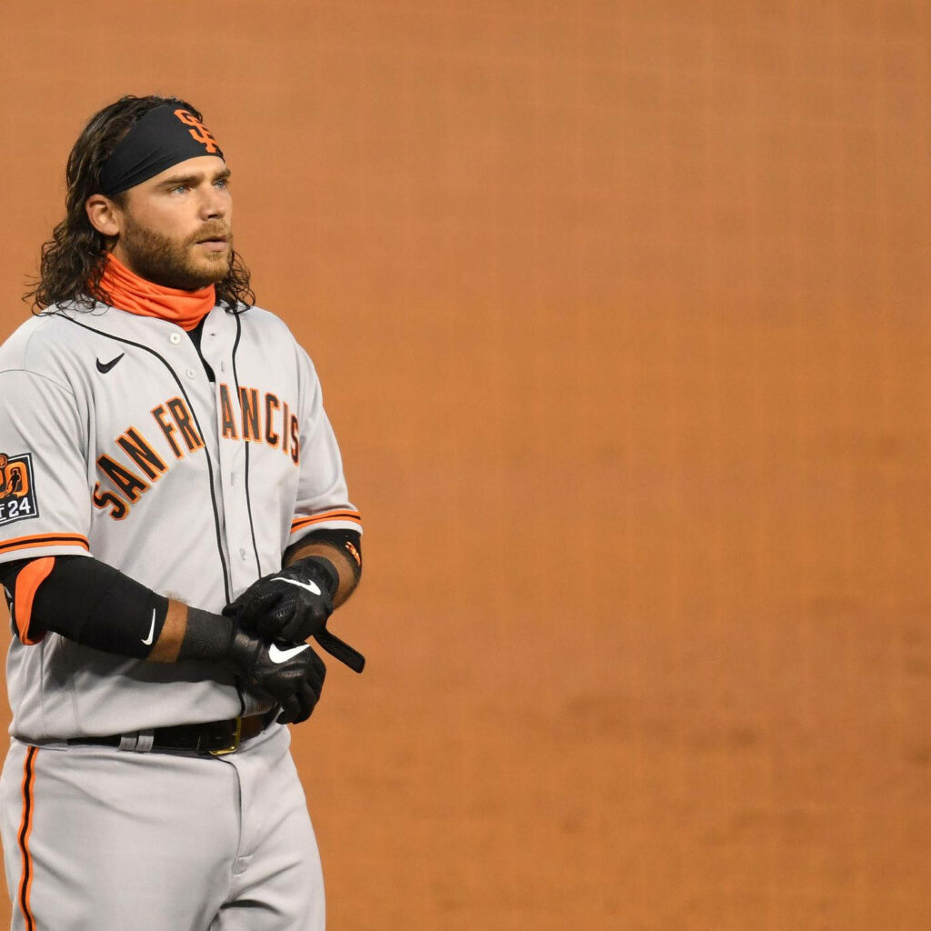 San Francisco Giants shortstop Brandon Crawford focused on baseball field in team uniform wallpaper