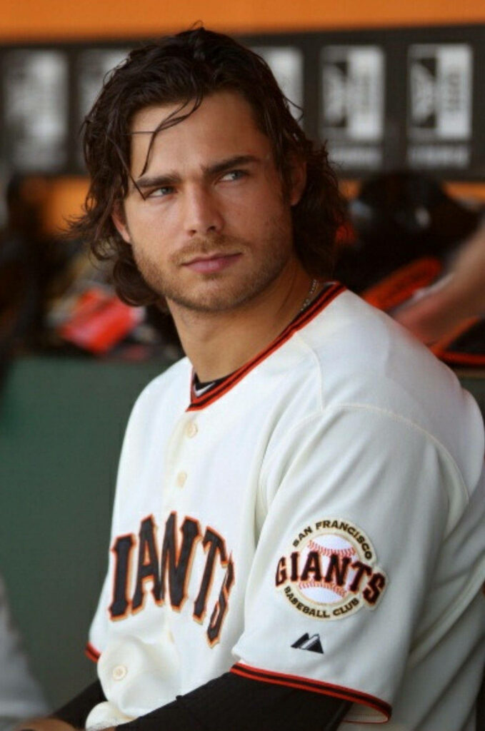 Brandon Crawford in San Francisco Giants jersey with long hair candid dugout sports wallpaper