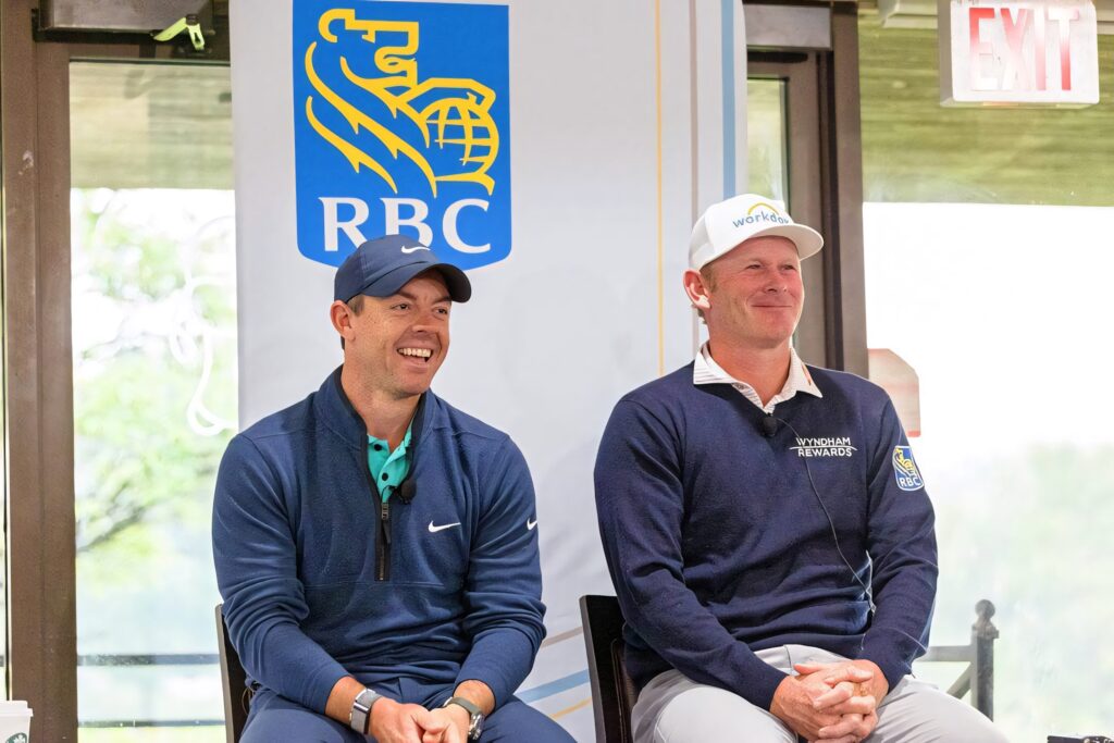 Brandt Snedeker and Luke List sitting together at RBC golf event in branded golf attire Wallpaper