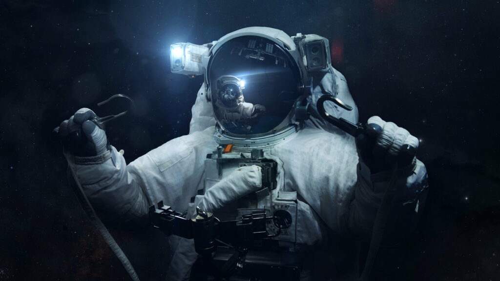 Brave Astronaut in the Dark Universe: A Stunning Spacewalk Wallpaper