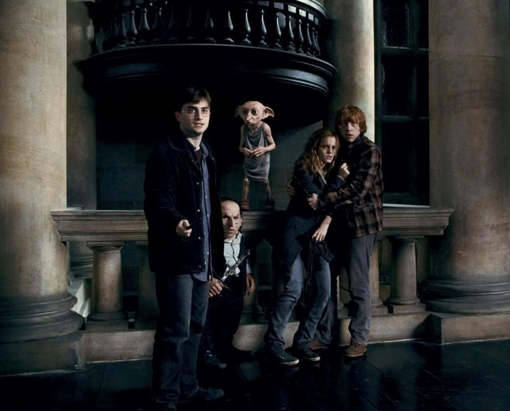 Dobby's Brave Encounter at Malfoy Manor: Harry Potter Trio Uniting against Darkness - Captivating Background Shot Wallpaper