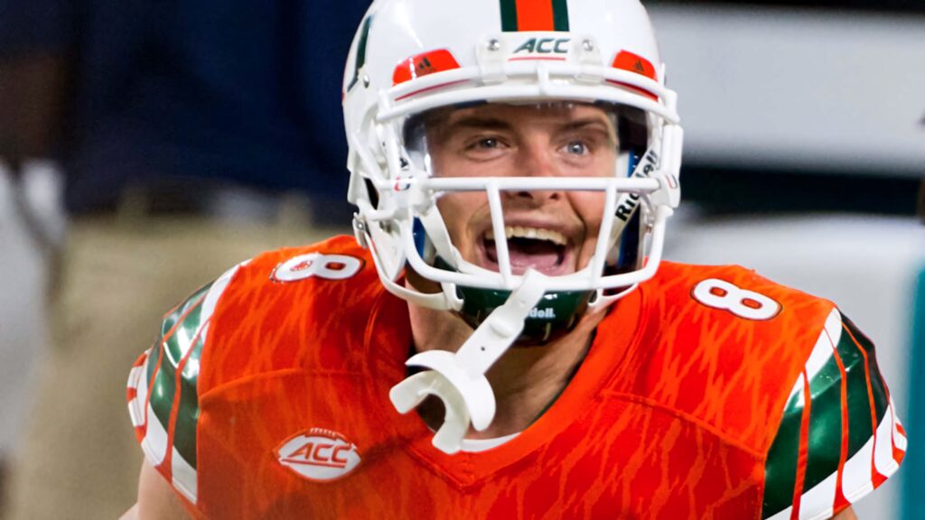 Braxton Berrios Miami Hurricanes football action intense expression orange uniform wallpaper