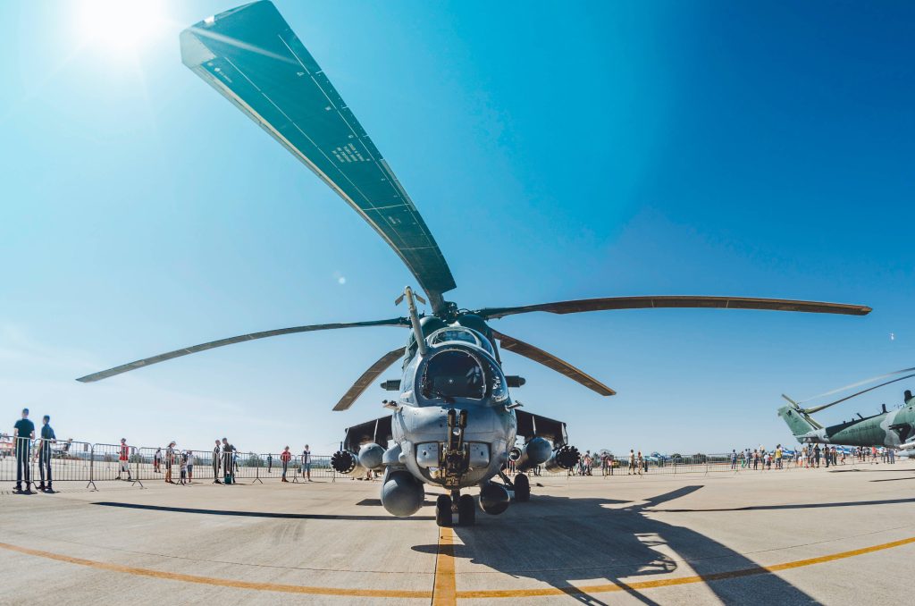 Front view of Brazilian Air Force Mil Mi-35M attack helicopter on sunny tarmac wide-angle lens Wallpaper