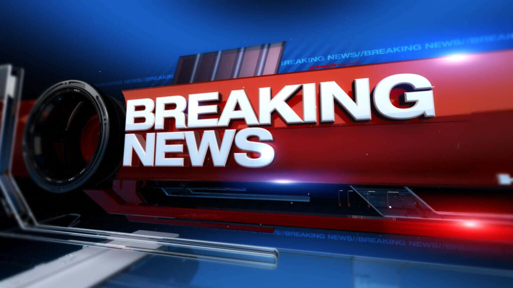 3D Breaking News graphic with bold white text on metallic red background and blue camera lens design Wallpaper