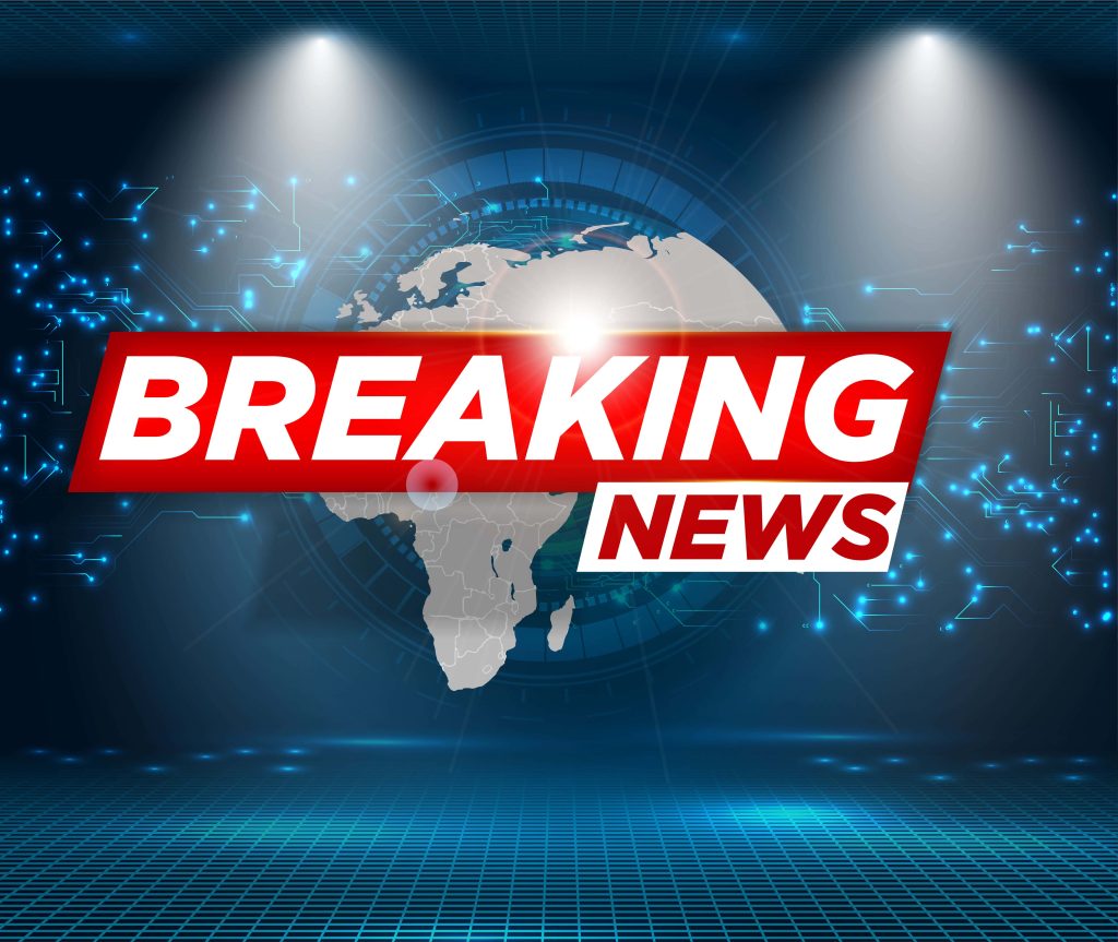 Breaking News graphic with red banner futuristic digital globe circuit board spotlight studio background Wallpaper