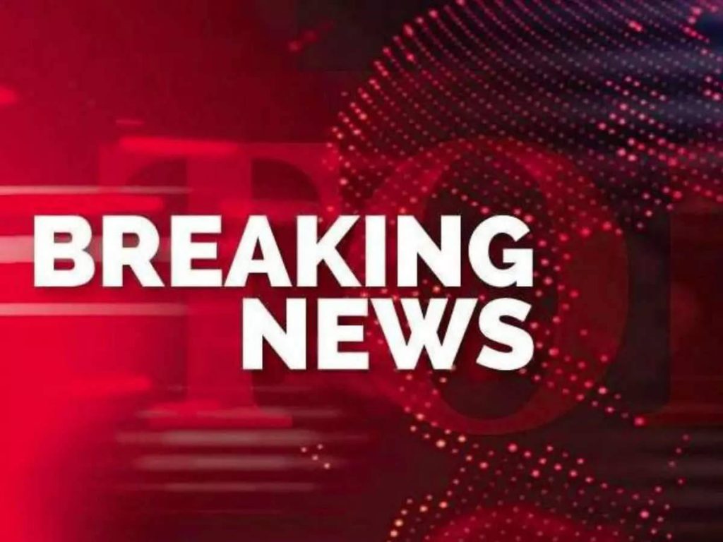Breaking News digital wallpaper with bold white text on vibrant red studio background and tech patterns
