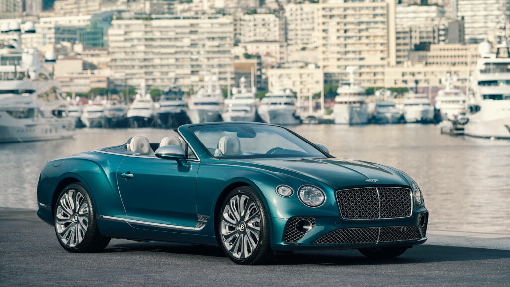 Luxury on the Waterfront: Bentley Continental GT in the Serene Harbor Wallpaper