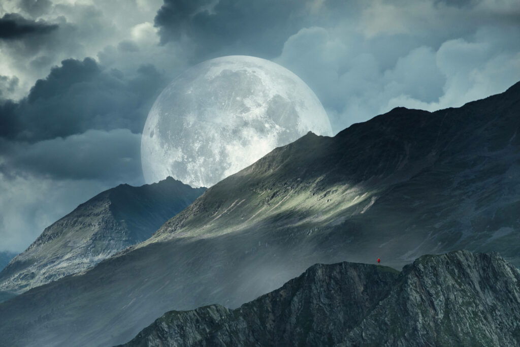 Breathtaking 4K Wallpaper: Full Moon Over Rugged Mountains