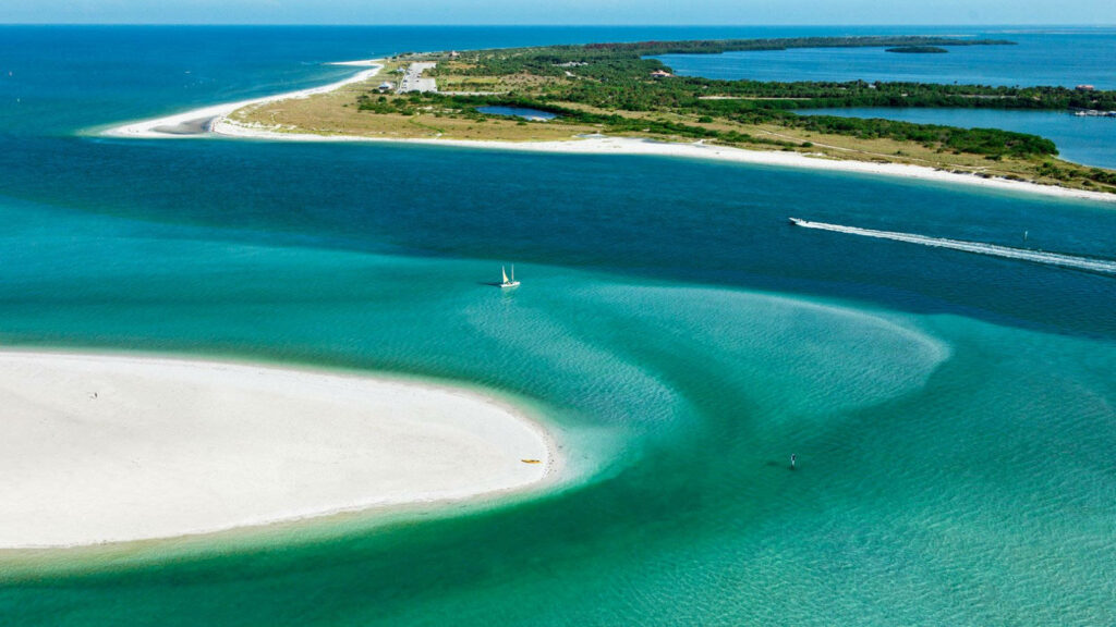 Breathtaking Aerial View: Pristine Beach & Turquoise Waters Wallpaper