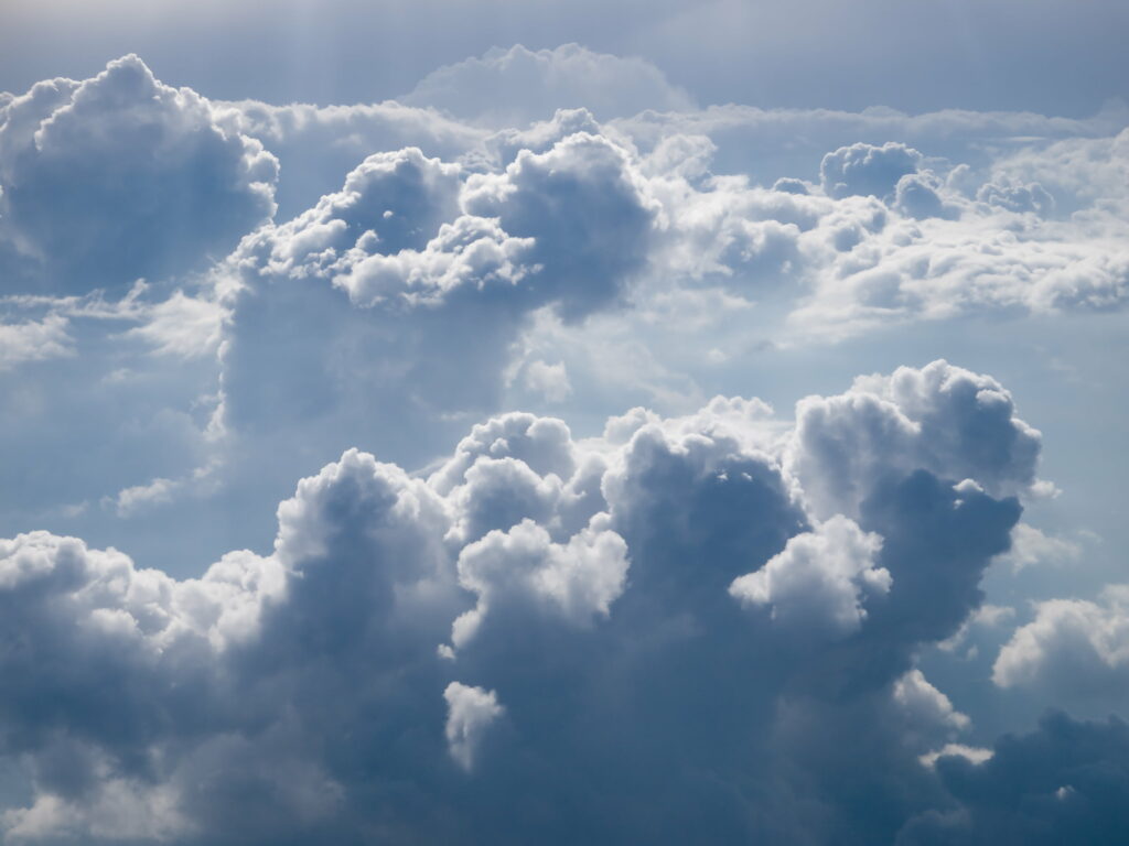 Breathtaking HD Aerial Wallpaper of Fluffy Clouds in Gentle Sunlight