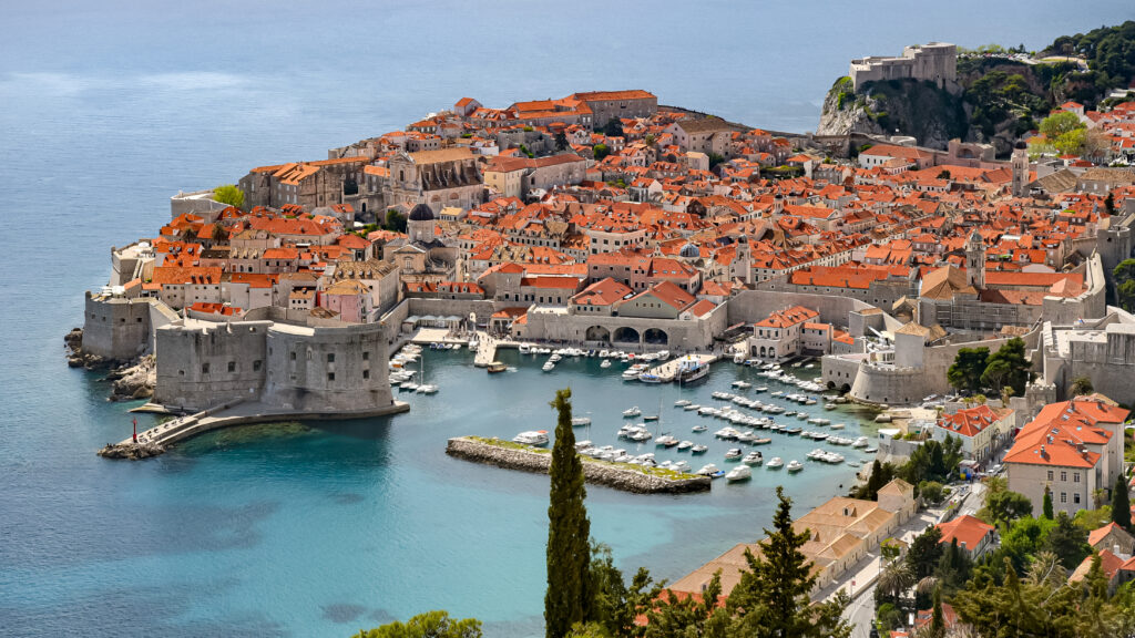 Stunning Aerial Wallpaper: Historic Coastal City & Pristine Blue Waters