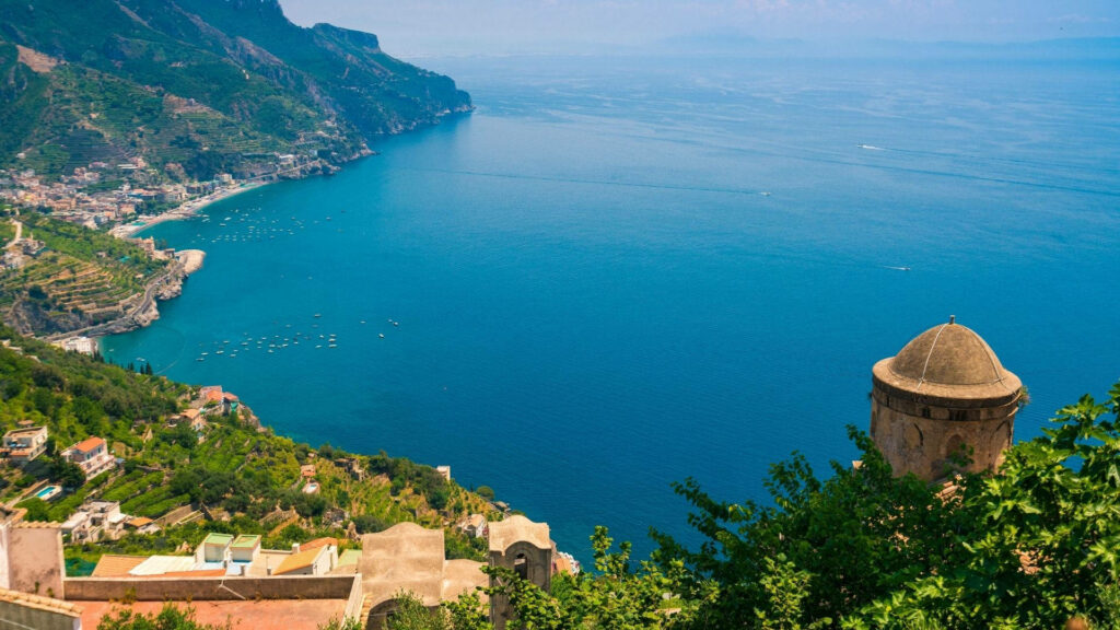 Breathtaking Amalfi Coast view from Ravello with blue waters cliffs and Mediterranean architecture Wallpaper
