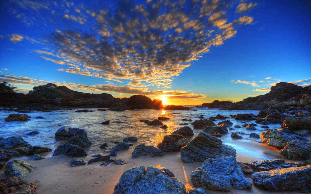 Breathtaking Australian Beach Sunset Wallpaper with Dramatic Clouds