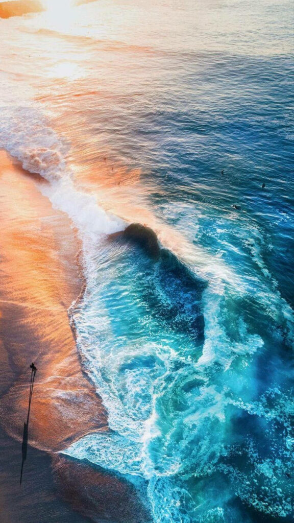Serene Beach Sunset Aerial - Vibrant Orange & Blue Wallpaper Background