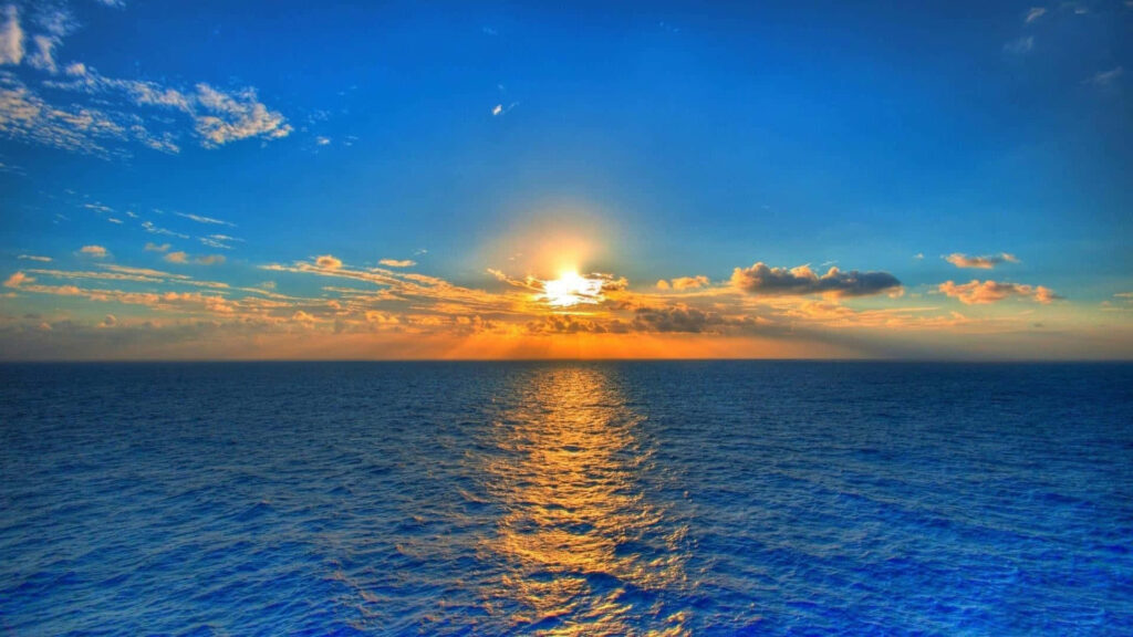 Serene Beach Sunset Wallpaper: Tranquil Ocean & Golden Rays