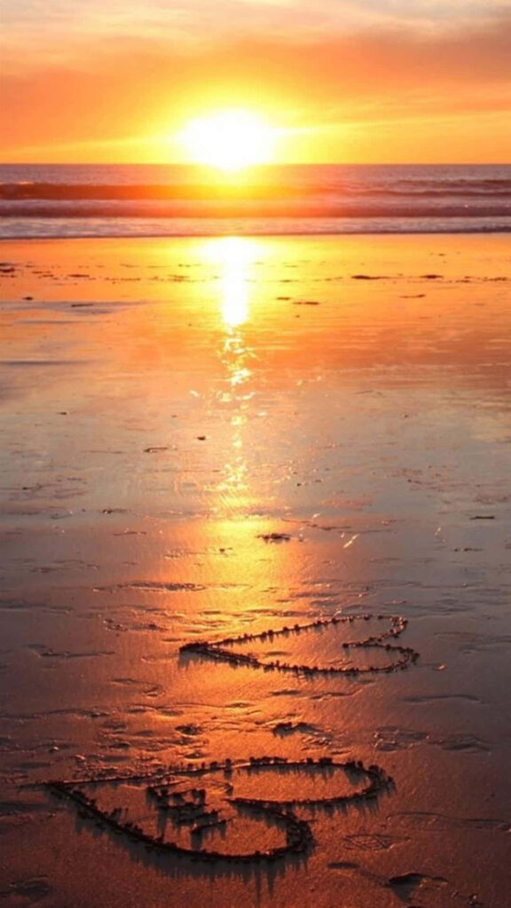 Breathtaking Beach Sunset: Warm Orange and Gold Reflections on Waves Wallpaper