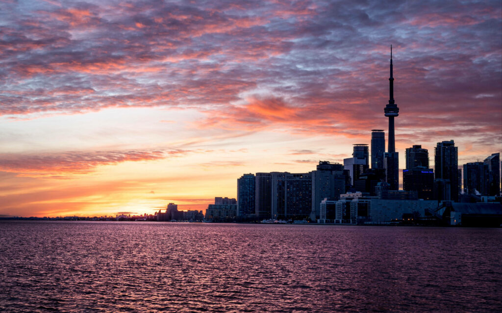 Vibrant CN Tower Silhouette Wallpaper Against Colorful Sunset