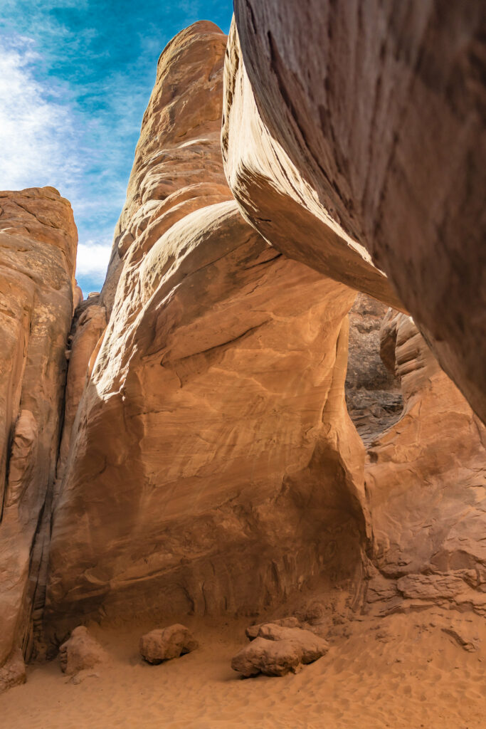 Breathtaking desert canyon with towering sandstone rocks deep gorge and vivid blue sky wallpaper