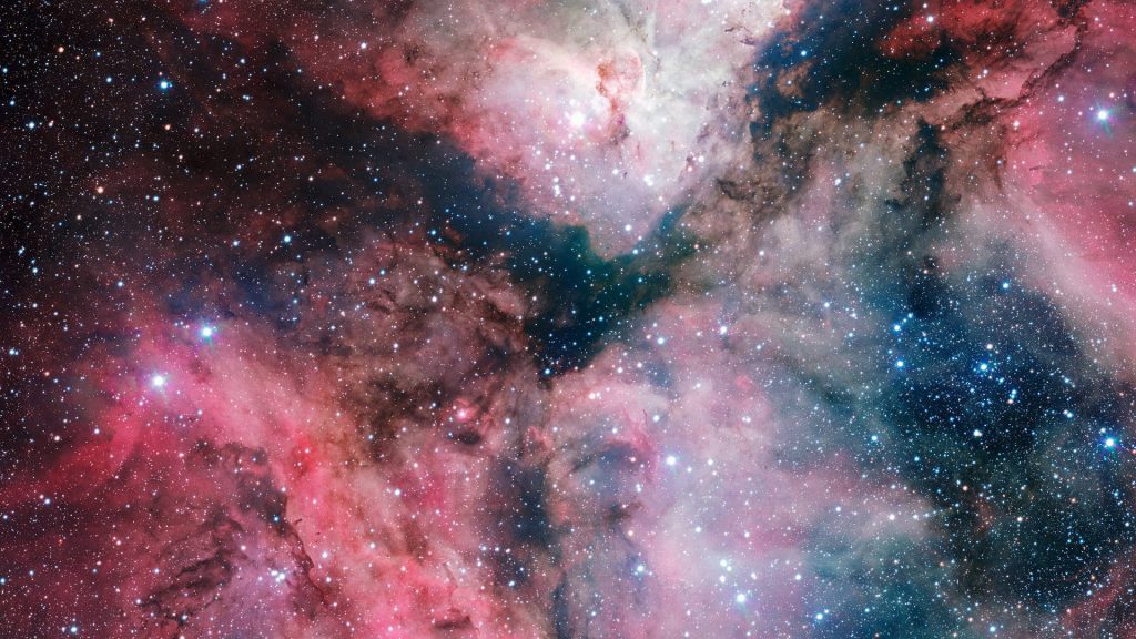 Breathtaking Carina Nebula starry space wallpaper with vibrant pink blue gas clouds and stars