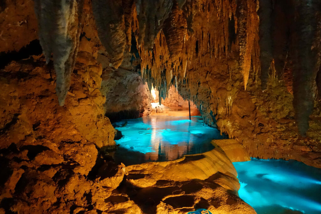 Breathtaking Cave Wallpaper: Sunlit Stalactites & Tranquil Waters