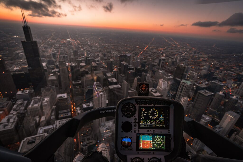 Stunning Aerial Sunset Cityscape Wallpaper from Aircraft Cockpit