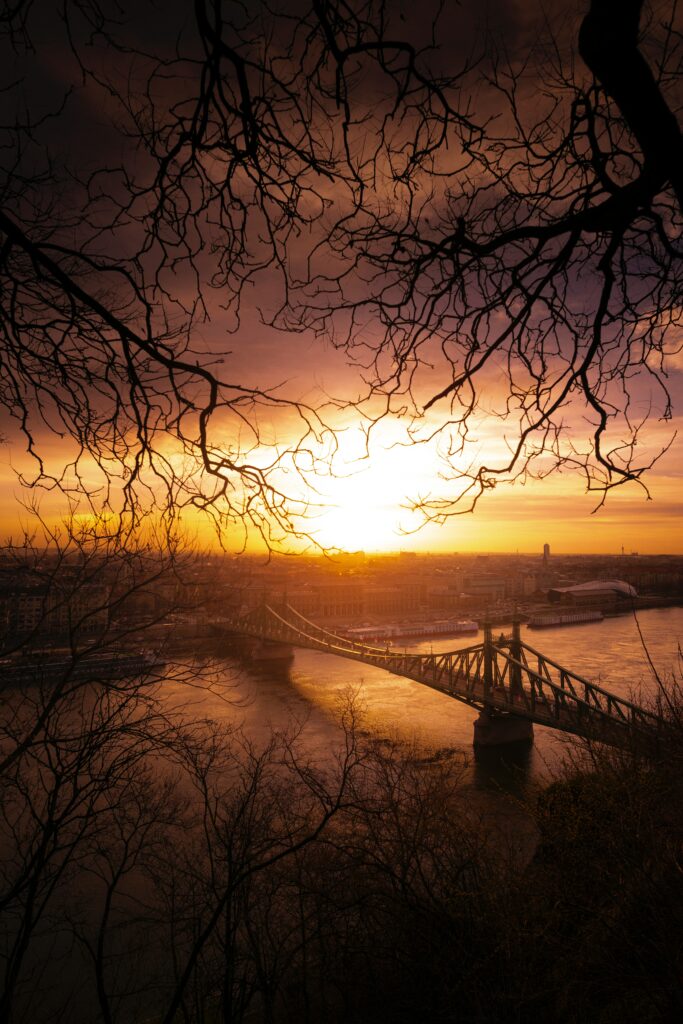 Stunning Cityscape Wallpaper: Sunset Over Bridge & River View