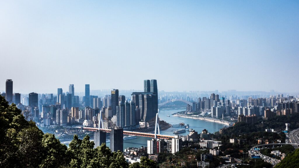 Stunning Cityscape Wallpaper: Aerial View with River & Greenery
