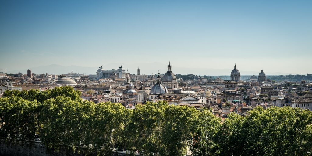 Breathtaking Cityscape Wallpaper: Historic Architecture & Blue Sky