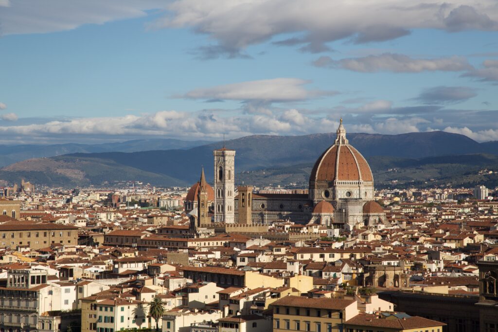 Timeless Cityscape Wallpaper: Iconic Dome & Tower Amid Historical Charm