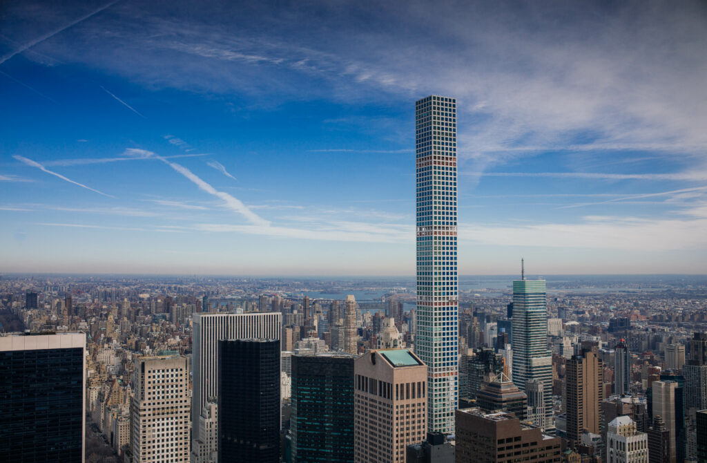 Breathtaking Cityscape Wallpaper: Towering Skyscrapers & Blue Sky