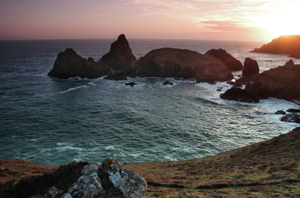 Breathtaking Sunset Coastal Scene: Cliffs, Waves, and Vibrant Sky Wallpaper