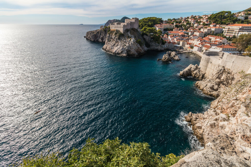 Breathtaking Croatia wallpaper with rocky coastline ancient stone buildings and blue Adriatic Sea