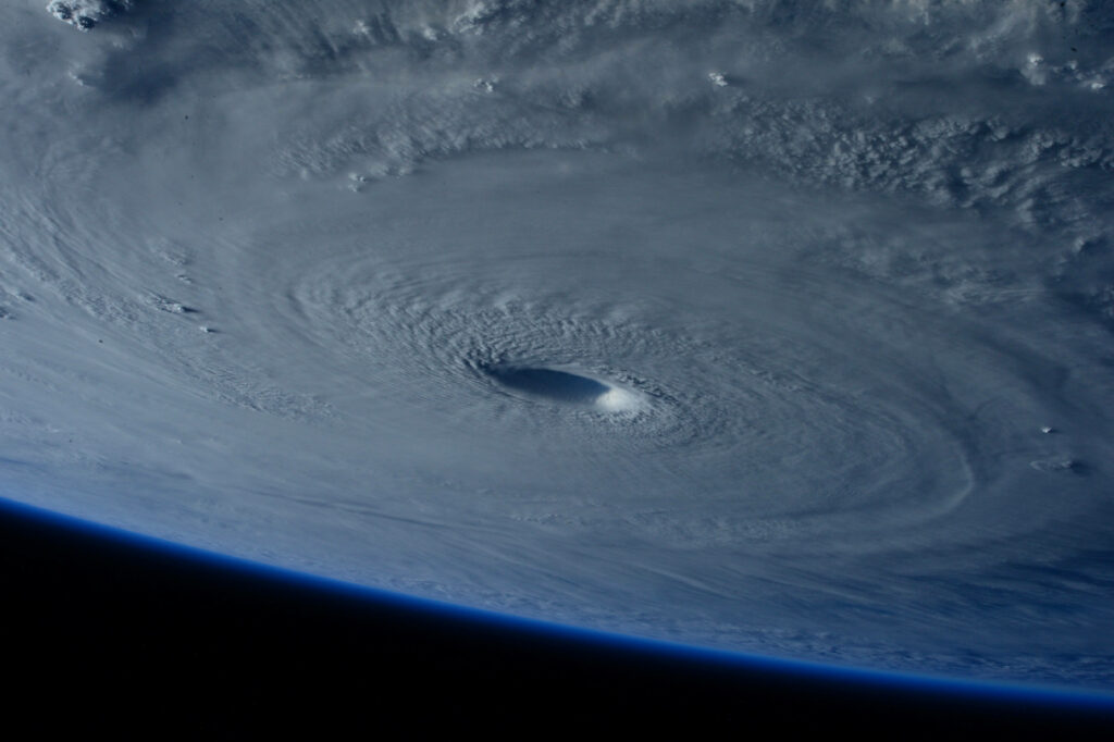 Stunning Cyclone Wallpaper: Space View of Storm and Earth's Curvature
