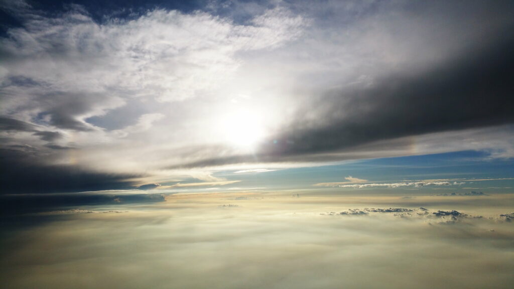 Breathtaking Daytime HD Wallpaper: Sunlit Clouds & Serenity