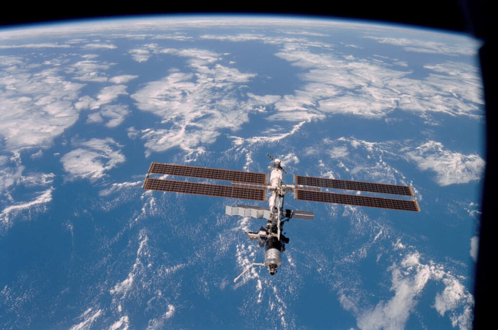 Breathtaking Earth View from Space: ISS & Oceans Wallpaper Background