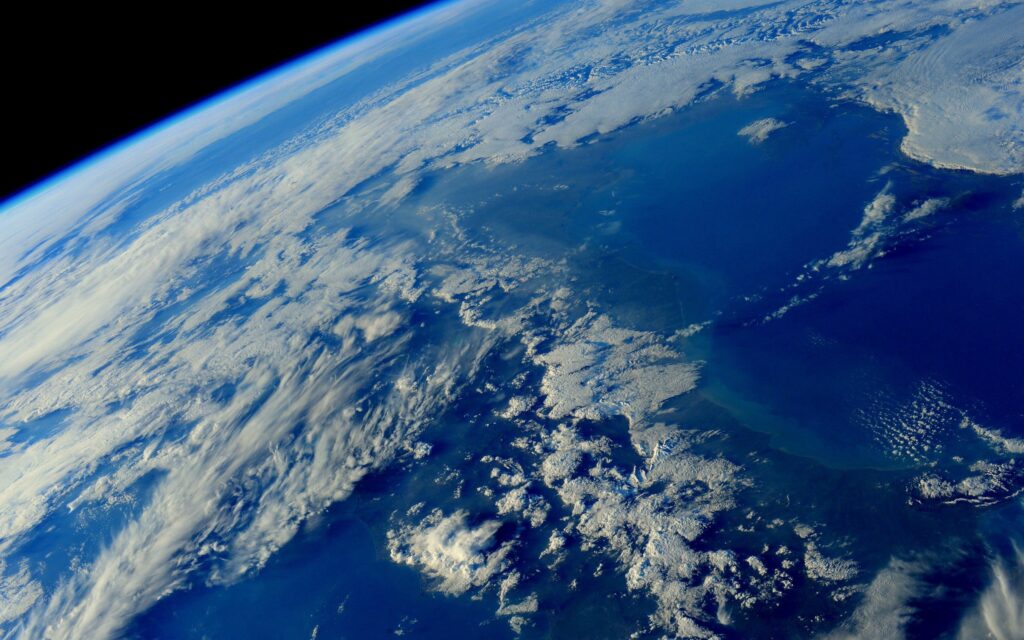 Breathtaking Earth Wallpaper: Stunning Space View with Oceans & Clouds