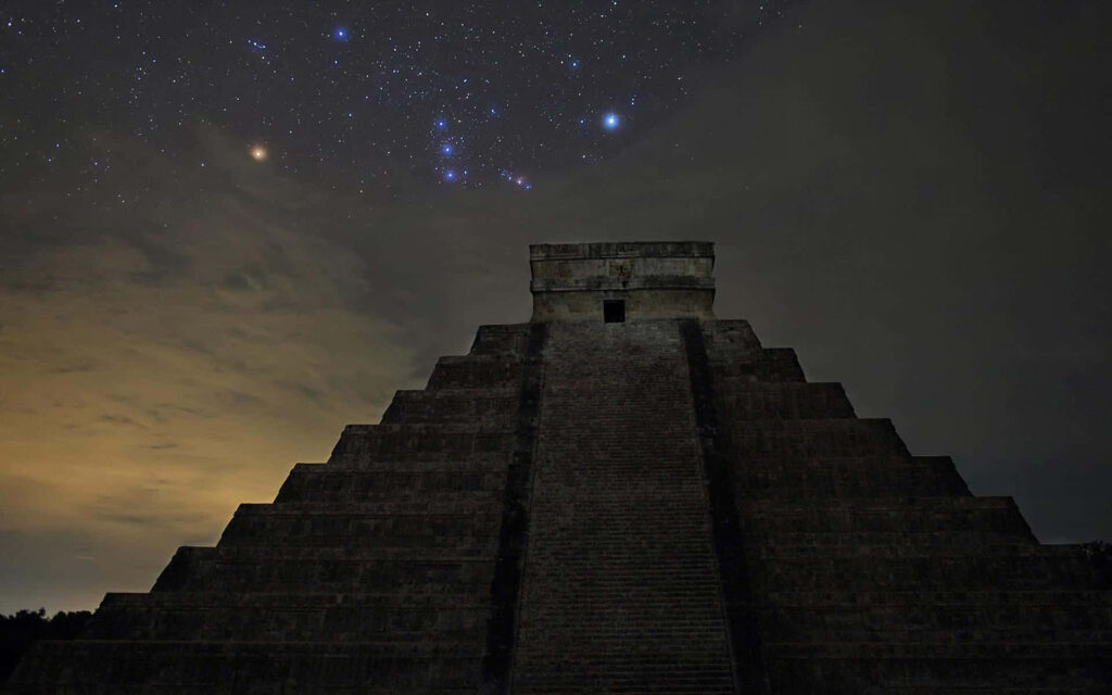 El Castillo Pyramid at Night: Stunning Wallpaper Background
