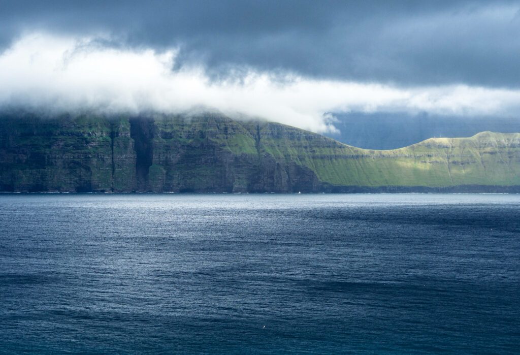 Serene Faroe Islands Wallpaper: Lush Cliffs & Calm Ocean Beauty