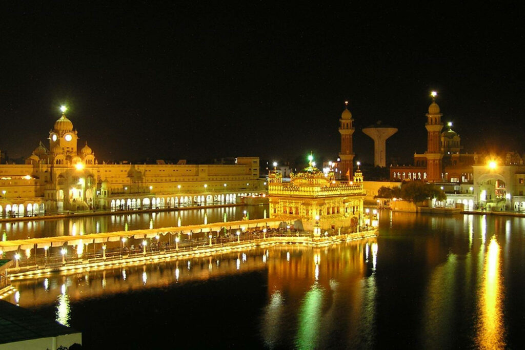 Golden Temple Night Reflection - Serene Wallpaper Background