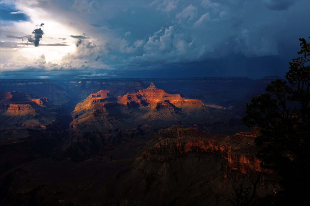 Breathtaking Grand Canyon Wallpaper: Sunset Through Storm Clouds