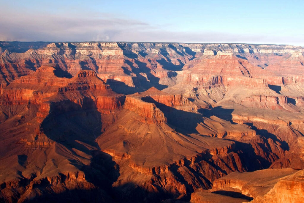 Breathtaking Grand Canyon Wallpaper: Red Rocks & Stunning Sunlit Views