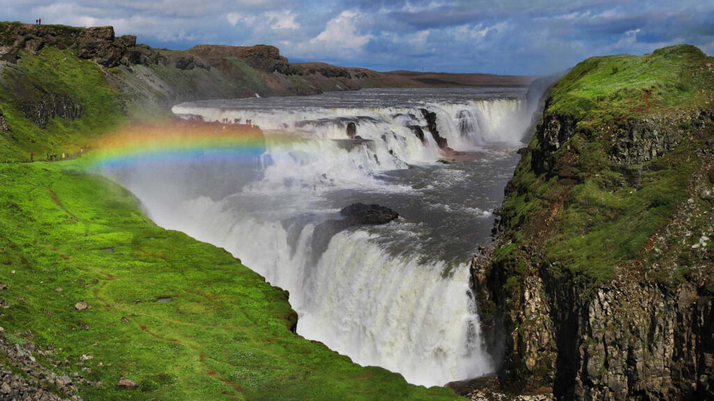 Stunning Gullfoss Waterfall Wallpaper with Rainbow & Lush Greenery