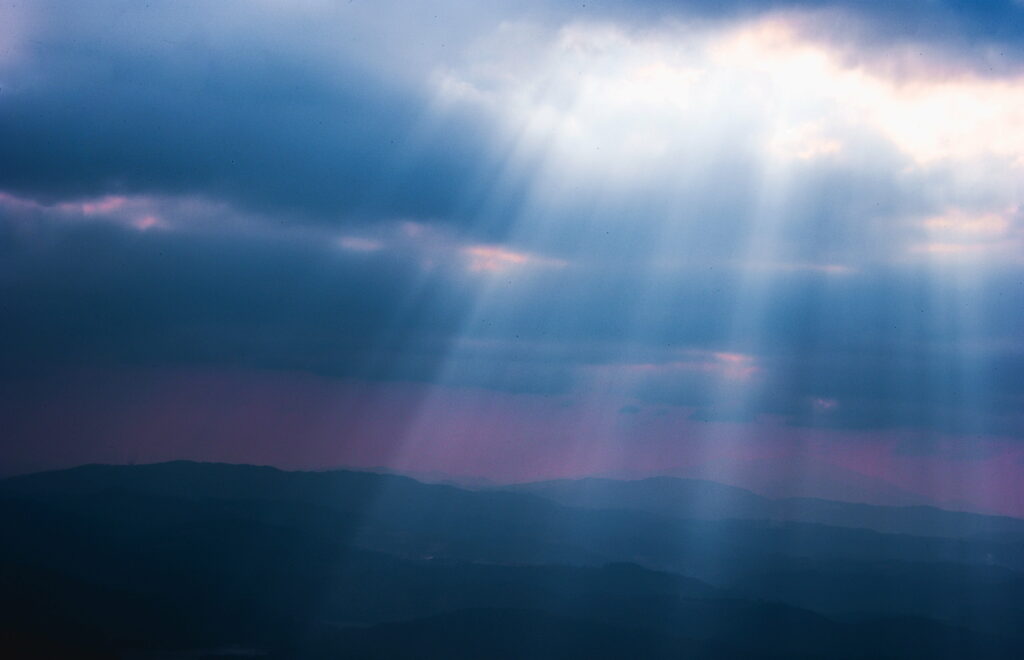Stunning HD Nature Wallpaper: Dramatic Clouds & Sunlight Over Landscape