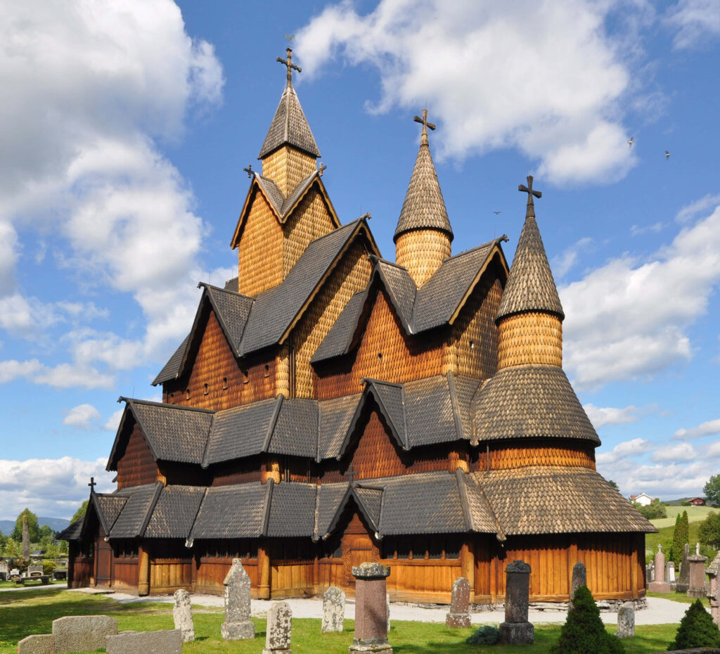 Breathtaking Heddal Stave Church Sunrise Wallpaper - Intricate Architecture