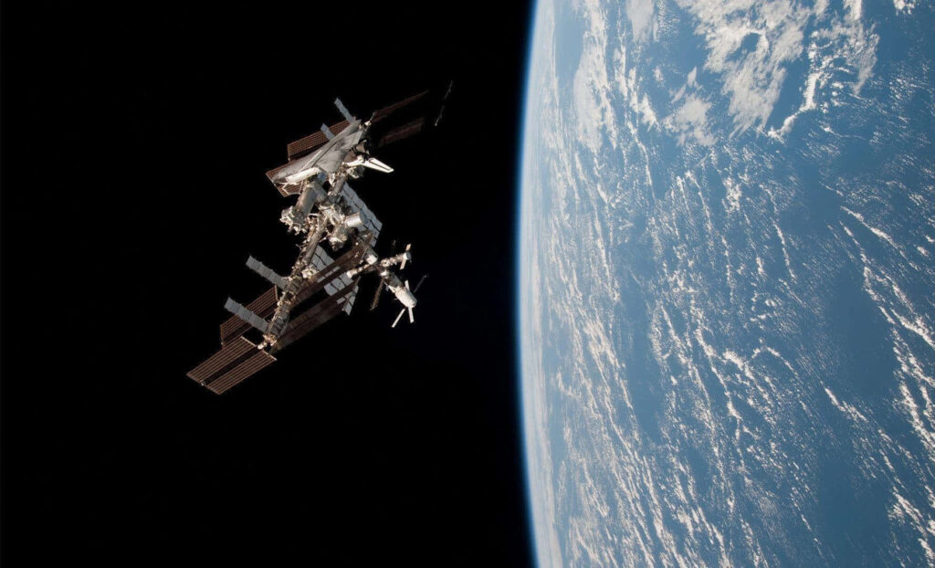 Breathtaking High-Res Wallpaper: International Space Station Over Earth