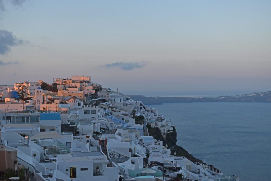 Breathtaking Wallpaper of Whitewashed Buildings & Serene Water View