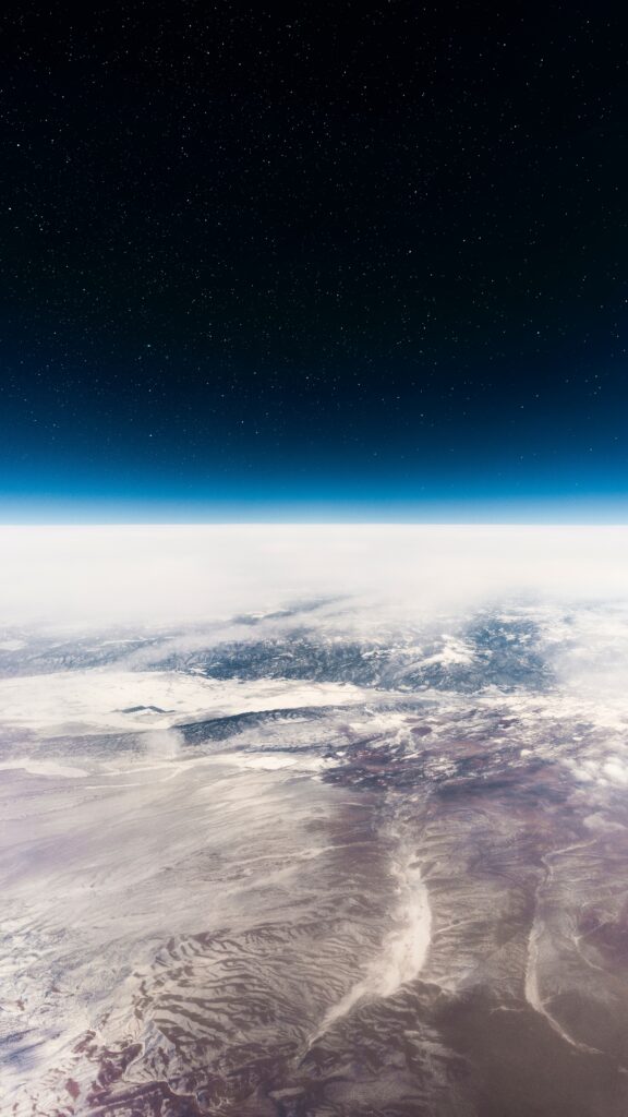 Breathtaking Interstellar Wallpaper: Planet Surface & Star-Filled Sky