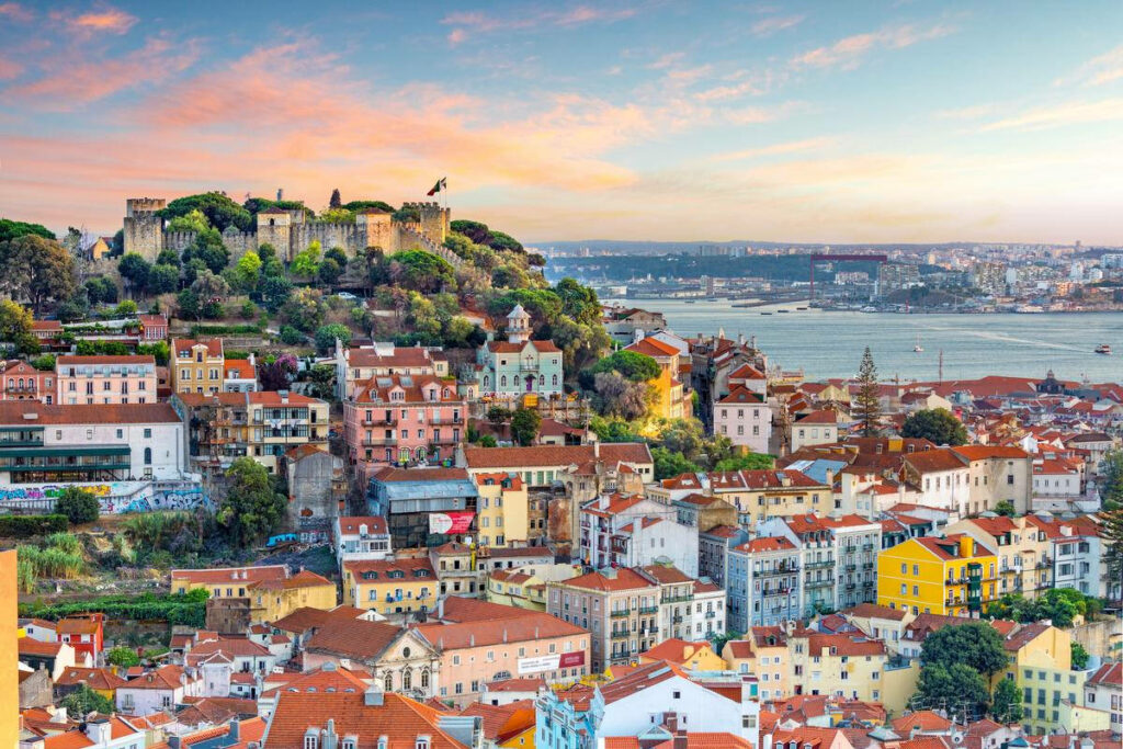 Vibrant Lisbon Cityscape Wallpaper: Sunset Over São Jorge Castle